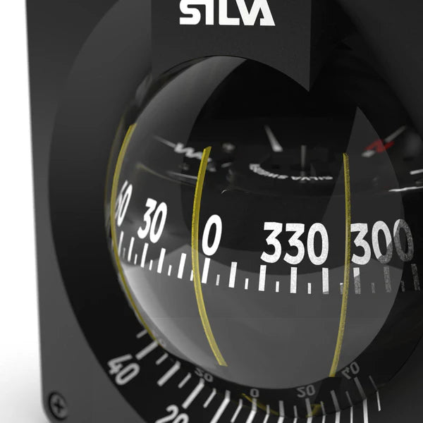 Silva compass with clear lens on a black background