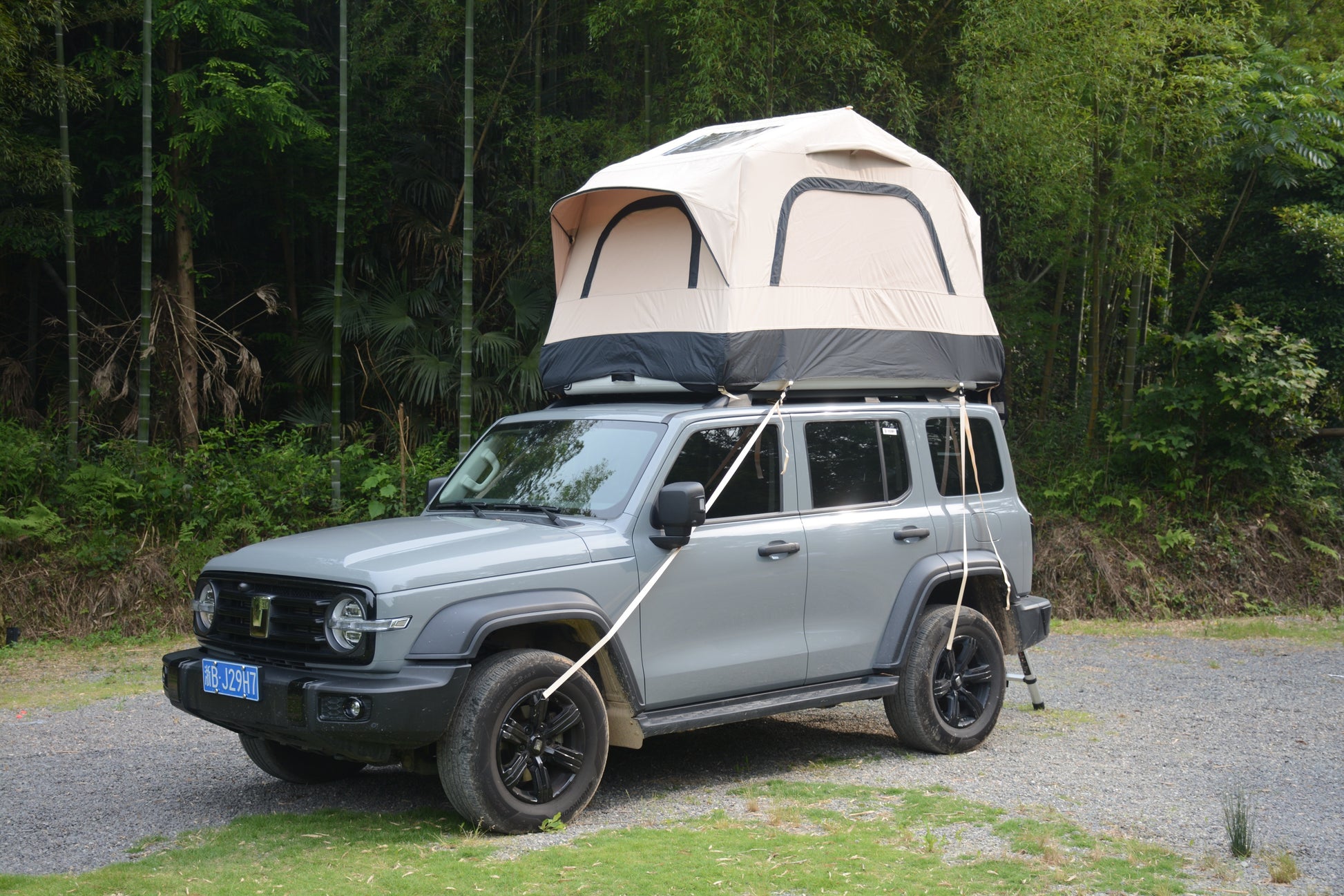 Side view of 2-Person Inflatable Roof Top Tent for camping, with telescoping ladder and mesh windows, Campingood